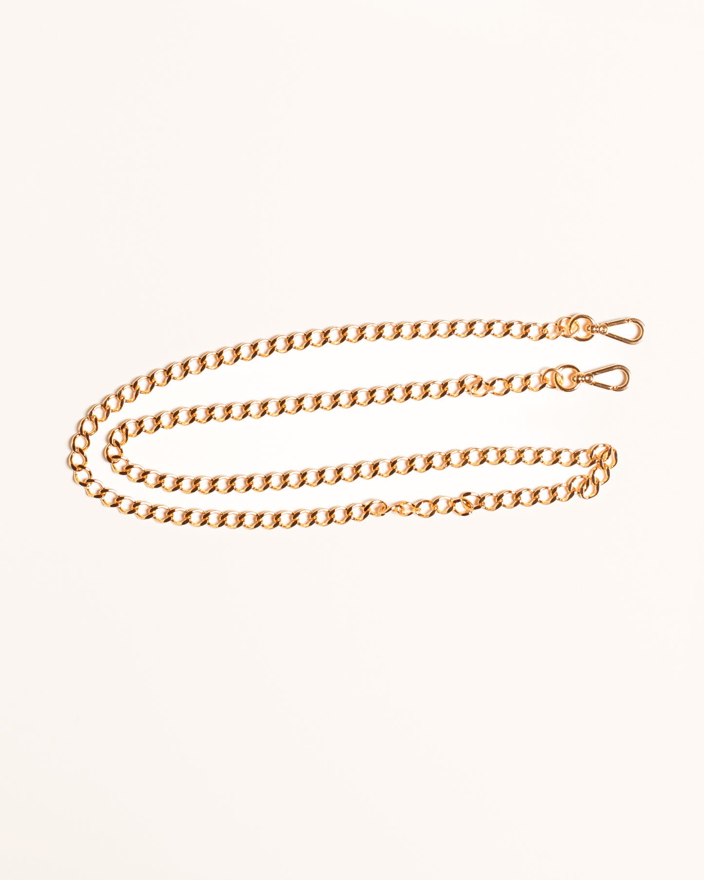 Alça de corrente dourada